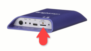 BrightSign LS hardware device with arrow pointing toward microSD card slot.