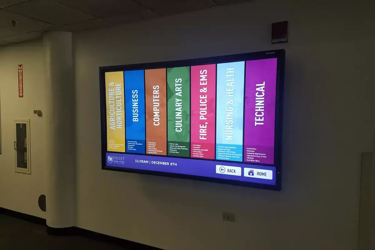 Joliet Junior College digital signage fullscreen programs menu board displays, Reach Media Network