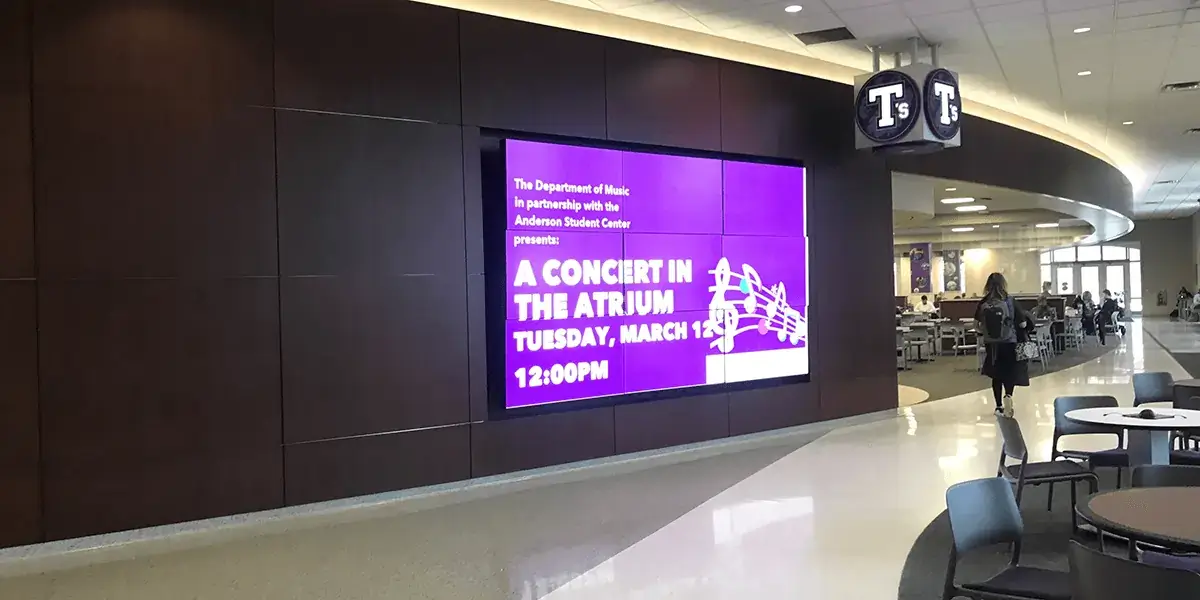 University of St. Thomas department of Music digital signage video wall from Reach Media Network announcing a concert in the atrium.