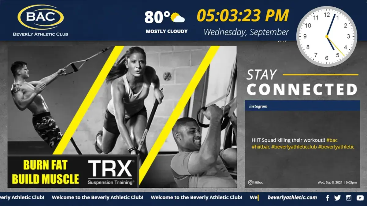 Beverly Athletic Club digital signage screen from Reach Media Network displaying TRX suspension training and Instagram posts.